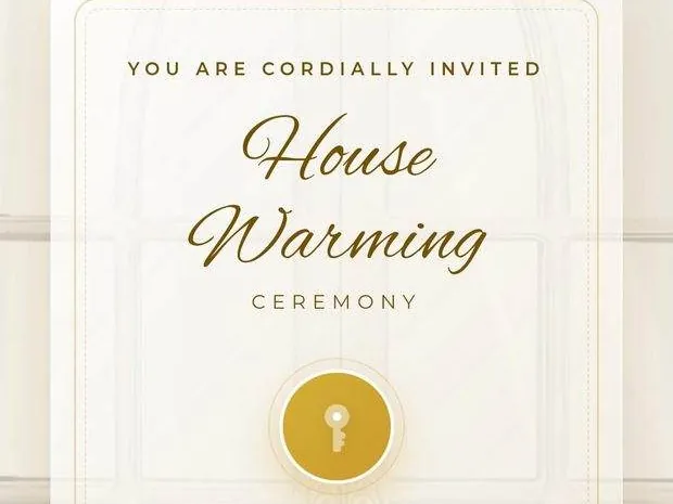 A housewarming invitation card with a gold key